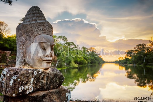 Bild på Stone face Asura and sunset over moat Angkor Thom Cambodia